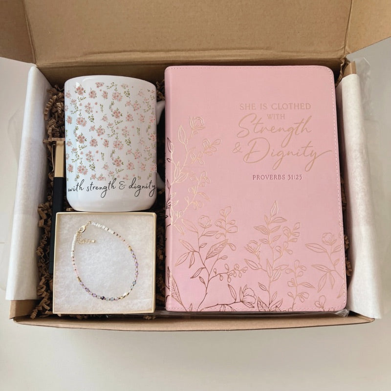 Faith-inspired gift box with floral mug, zip journal, pen, intention bracelet, and affirmation card