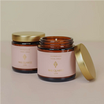 Vanilla-scented soy candle with Rose Quartz crystal for love and self-care, handcrafted and toxin-free
