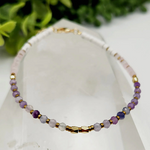 Calming stretch bracelet made with Fluorite, Amethyst, Rose Quartz, and Howlite beads for peace, clarity, and heart-centered energy