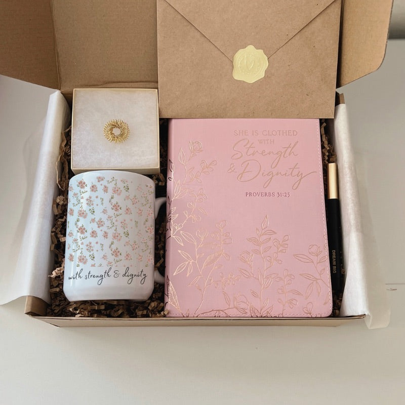 Gift box with sakura floral mug, grounding ring, pen, faith journal, and affirmation card